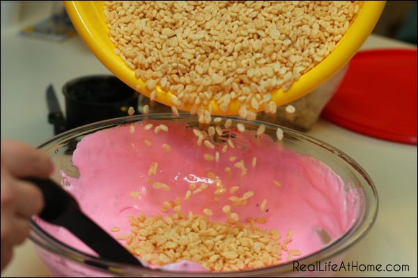 Combining Rice Krispies and Peep Marshmallow Mixture for Peep Rice Krispie Layered Dessert