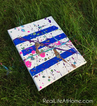 Outdoor splatter painting activity using painters tape