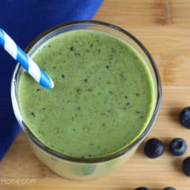 Easy to make and full of vitamins and nutrients, this Blueberry Peach Green Smoothie is delicious to drink and sure to please adults and children alike. | Real Life at Home