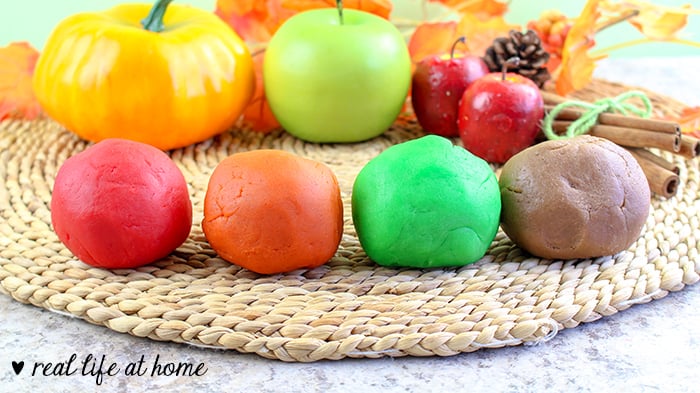 Directions for how to make fall-themed homemade scented playdough including recipes for pumpkin playdough, apple playdough, and cinnamon playdough. | Real Life at Home