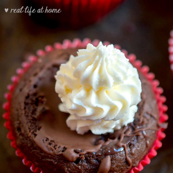 Vanilla buttercream frosting on hot chocolate cupcakes