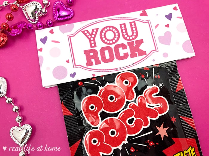 Need a quick treat bag for Valentine's Day, a class party, a team motivator, or just a little pick me up? Print out this free "You Rock" Pop Rocks Treat Bag Topper and attach it to a bag of Pop Rocks, rock candy, chocolate rocks, or a Ring Pop for a quick and easy surprise. 