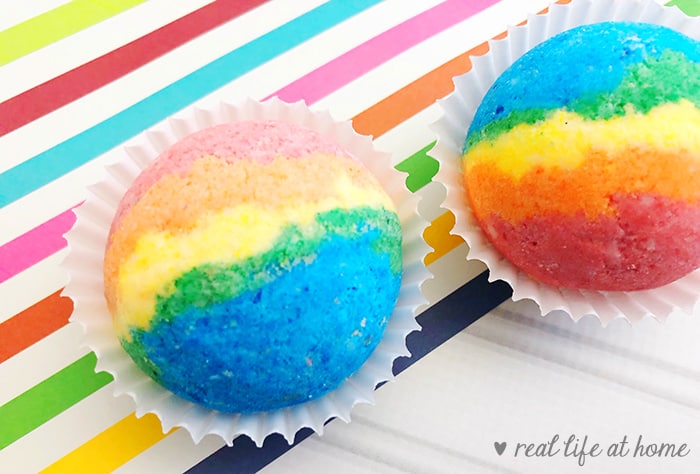 How to Make Homemade Rainbow Bath Bombs - here are two examples with different levels of coloring