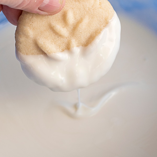 Dipping Homemade Butter Cookies in White Chocolate Dip