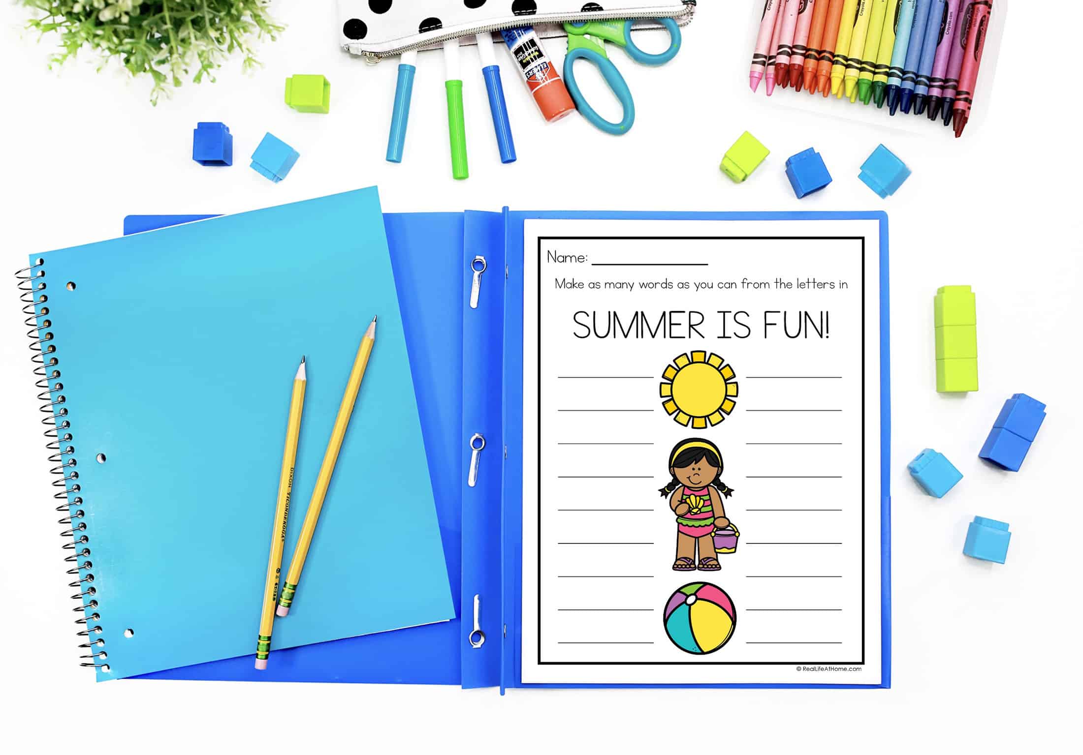 Summer is Fun Printable Activity on a Desktop surrounded by school supplies