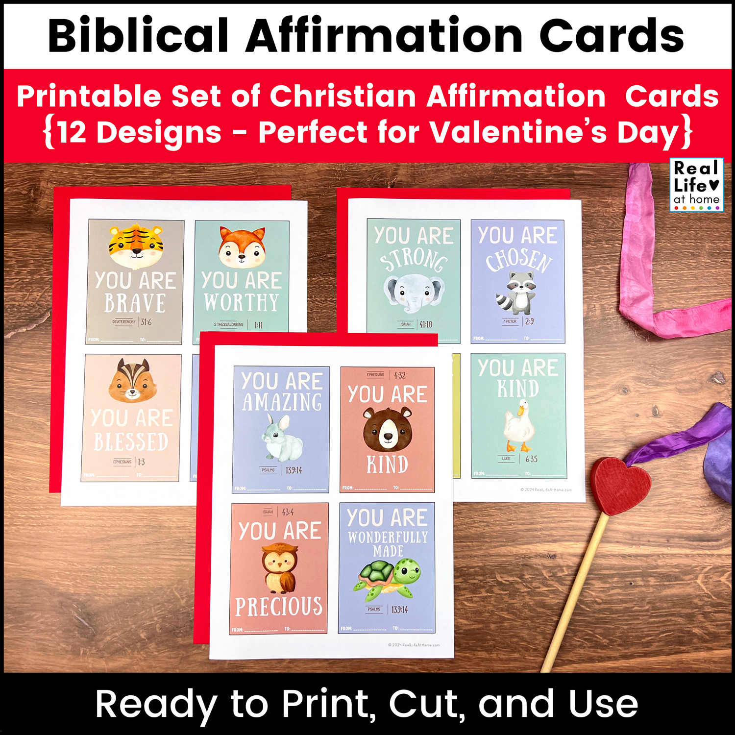 Biblical Affirmation Cards for Kids on a wooden surface with a heart ribbon wand near them